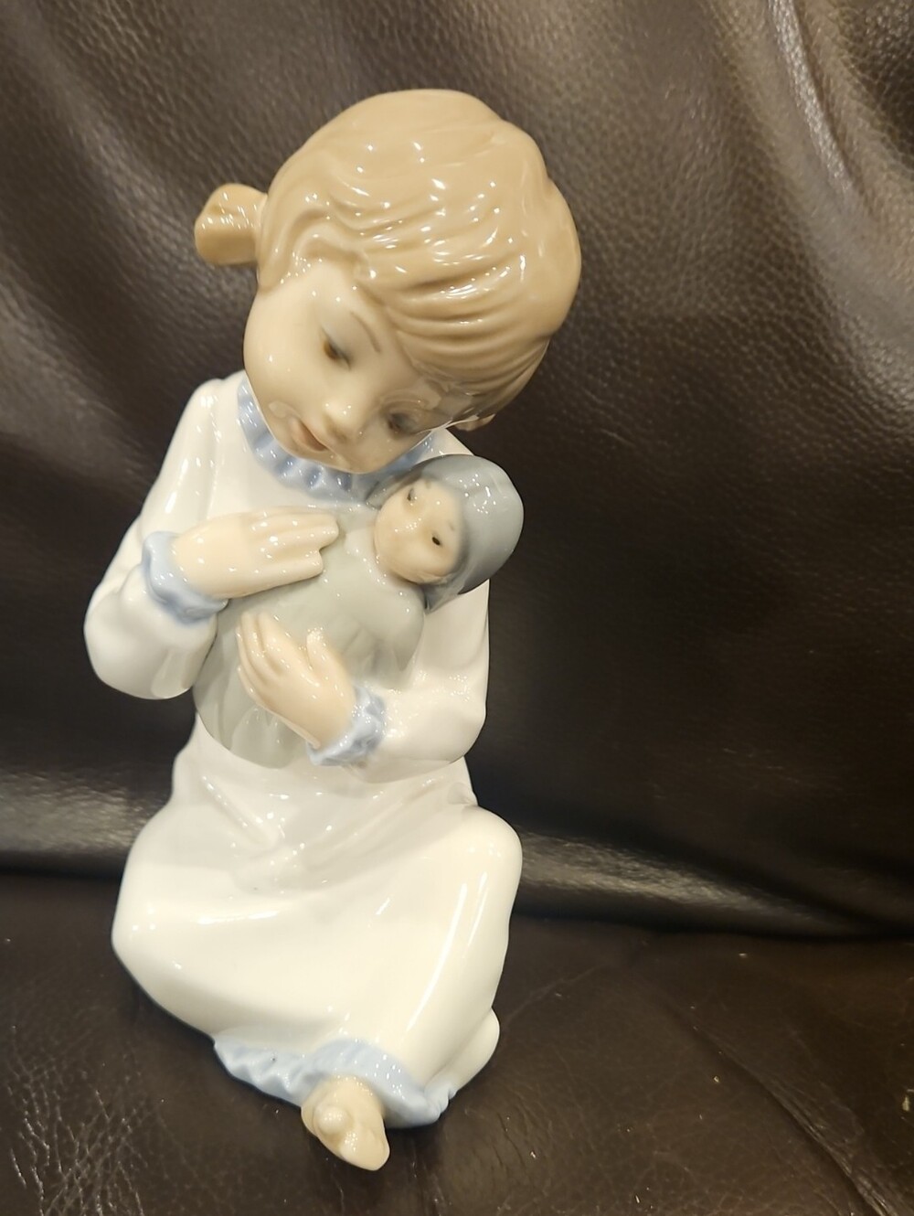 Zaphir Porcelain Figurine of Girl Holding Doll -